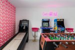 Game Room Features 75 Inch TV, Board Games, A Foosball Table, Skee-Ball And Two Classic Arcade Games